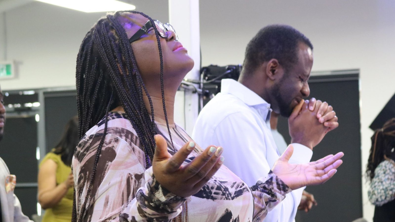 A worshipper with hands lifted in praise